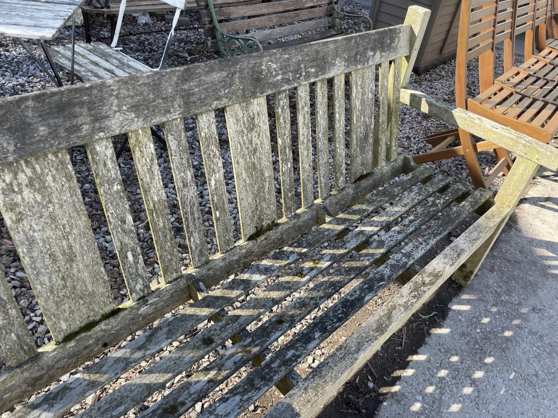 A WOODEN SLATTED THREE SEATER GARDEN BENCH - Image 2 of 2