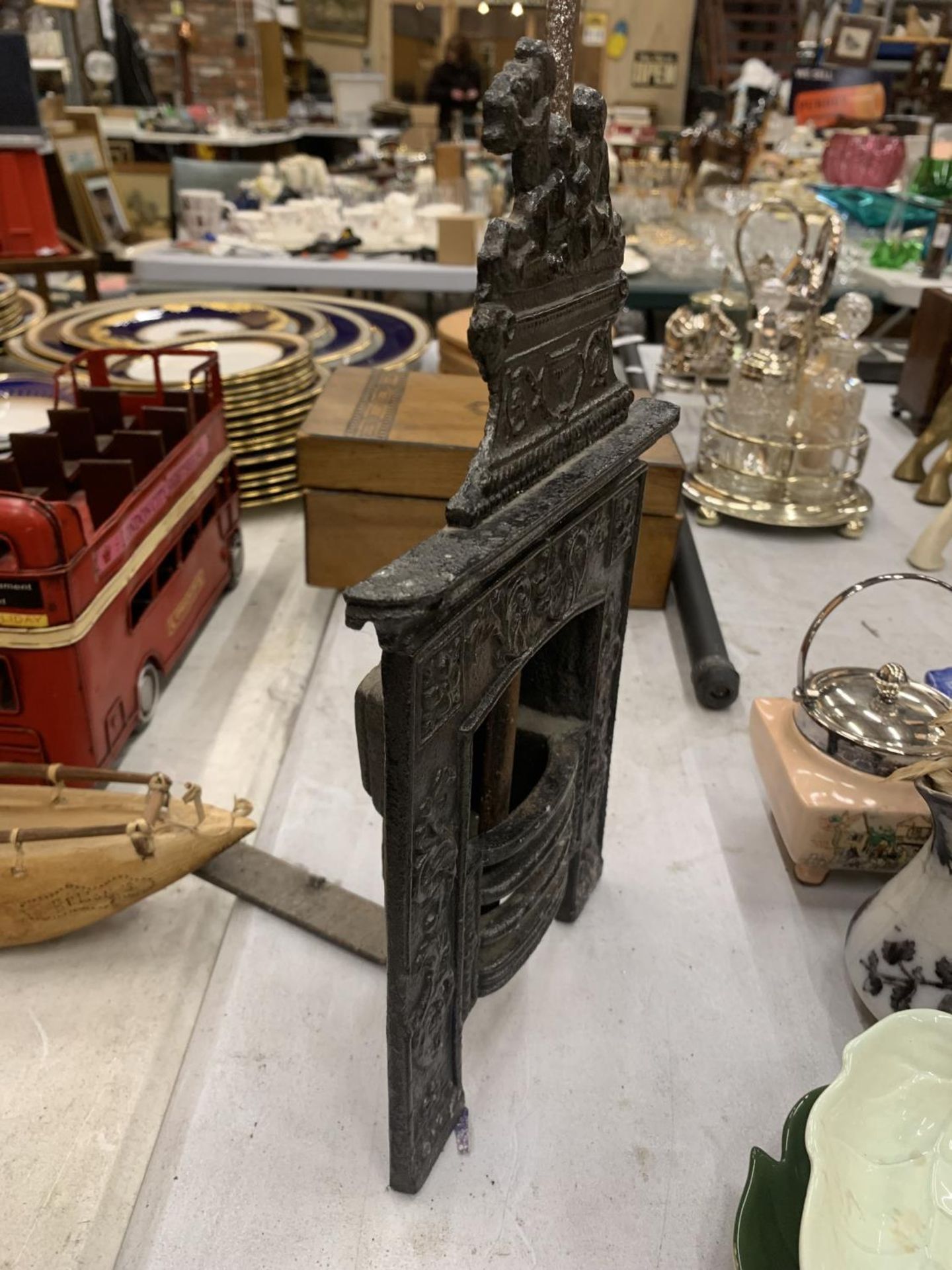 A VINTAGE MINIATURE CAST FIREPLACE WITH POKER HEIGHT 31CM, WIDTH 19CM - Image 2 of 3