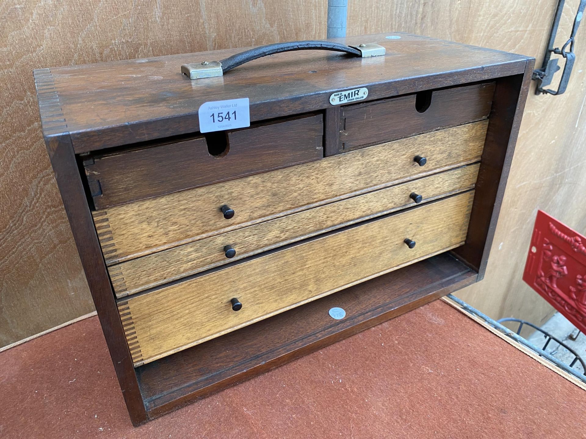 A VINTAGE FIVE DRAWER WOODEN JOINERS CHEST BEARING THE LABEL ' MADE IN EMIR LONDON ENGLAND'