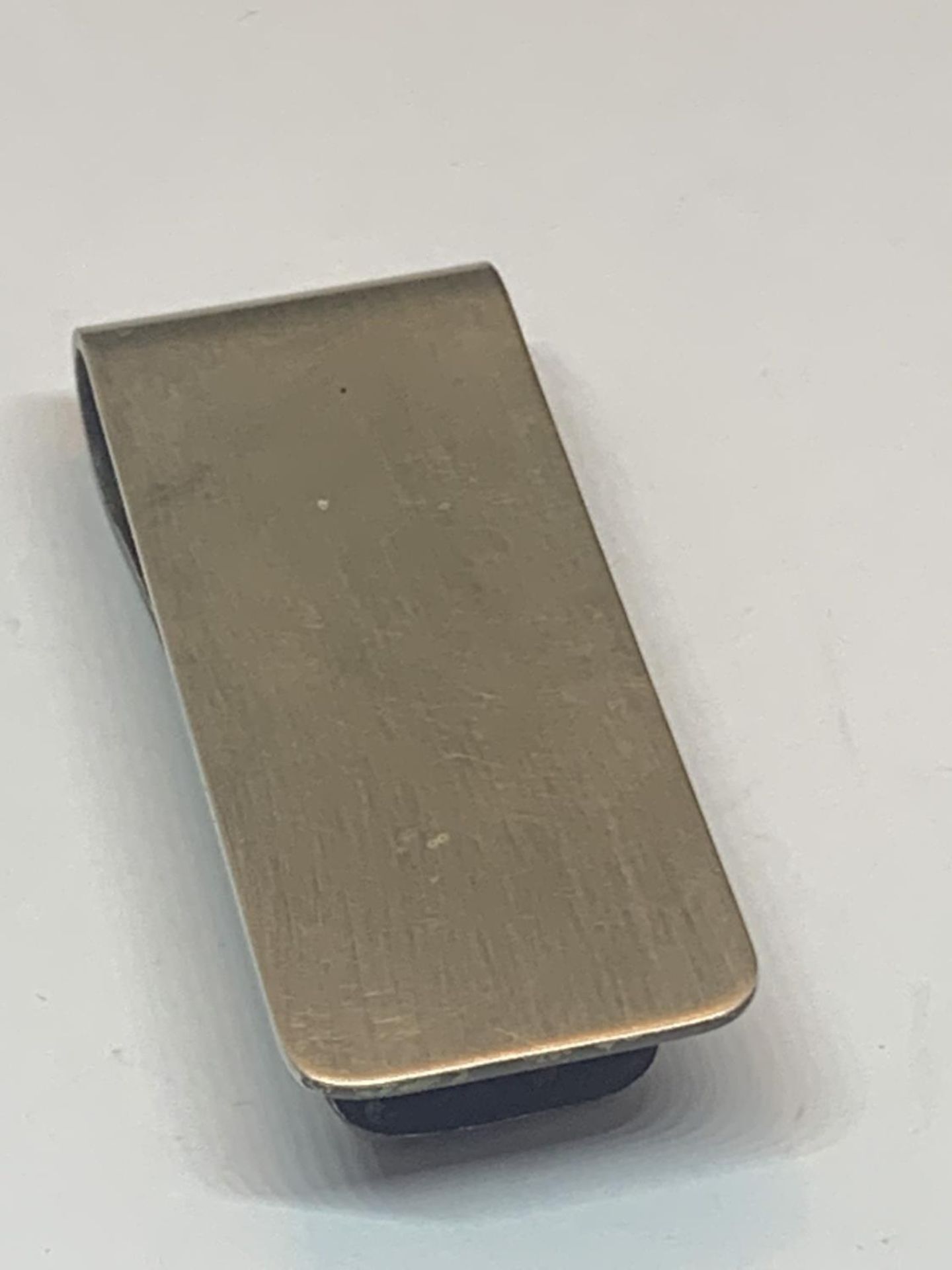 A MARKED SILVER MONEY CLIP