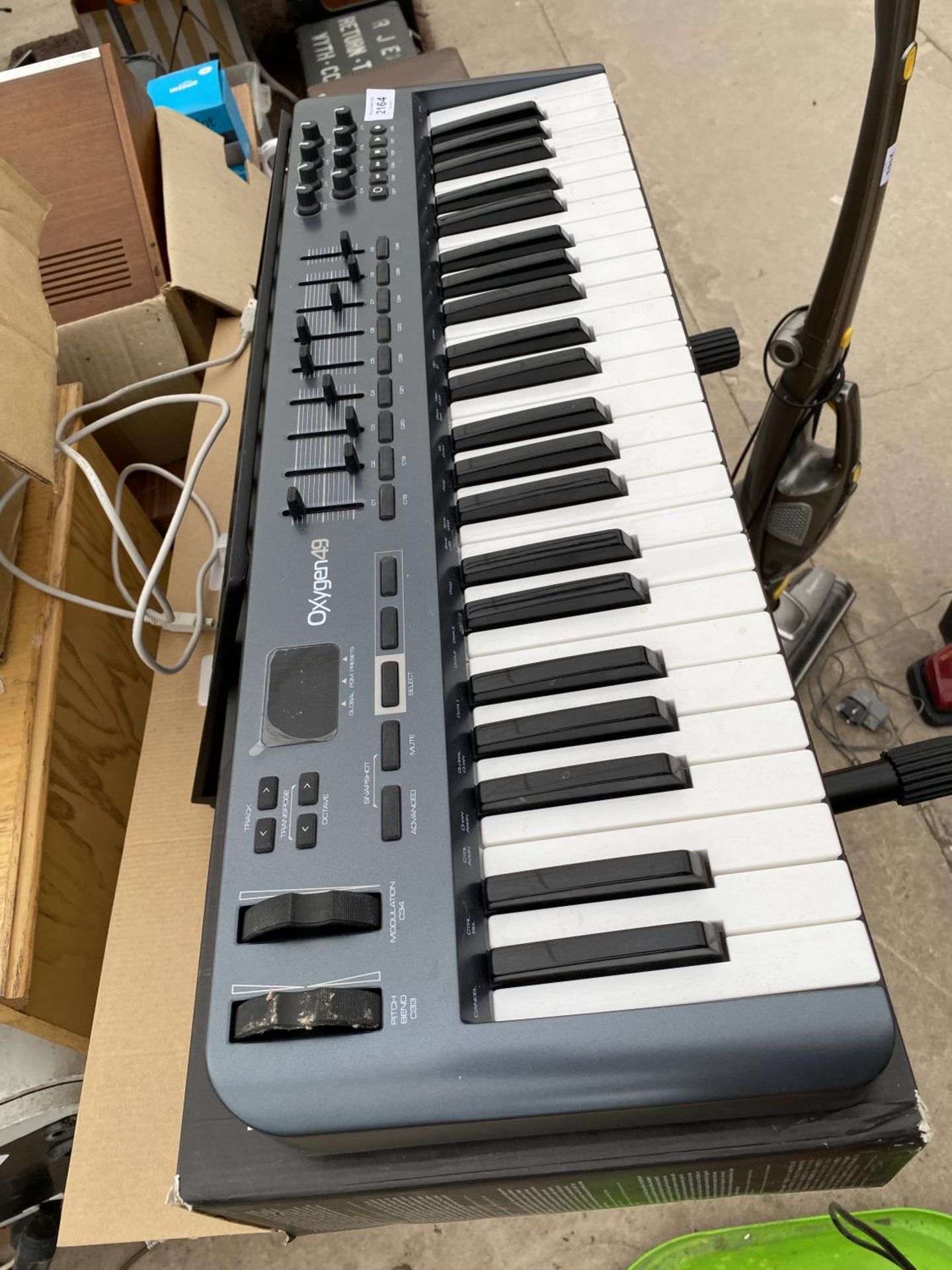 AN OXYGEN 49 ELECTRIC KEYBOARD AND STAND - Image 2 of 2