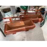 TWO WOODEN TROUGH PLANTERS WITH PLASTIC INSERTS AND TRELIS BACKS