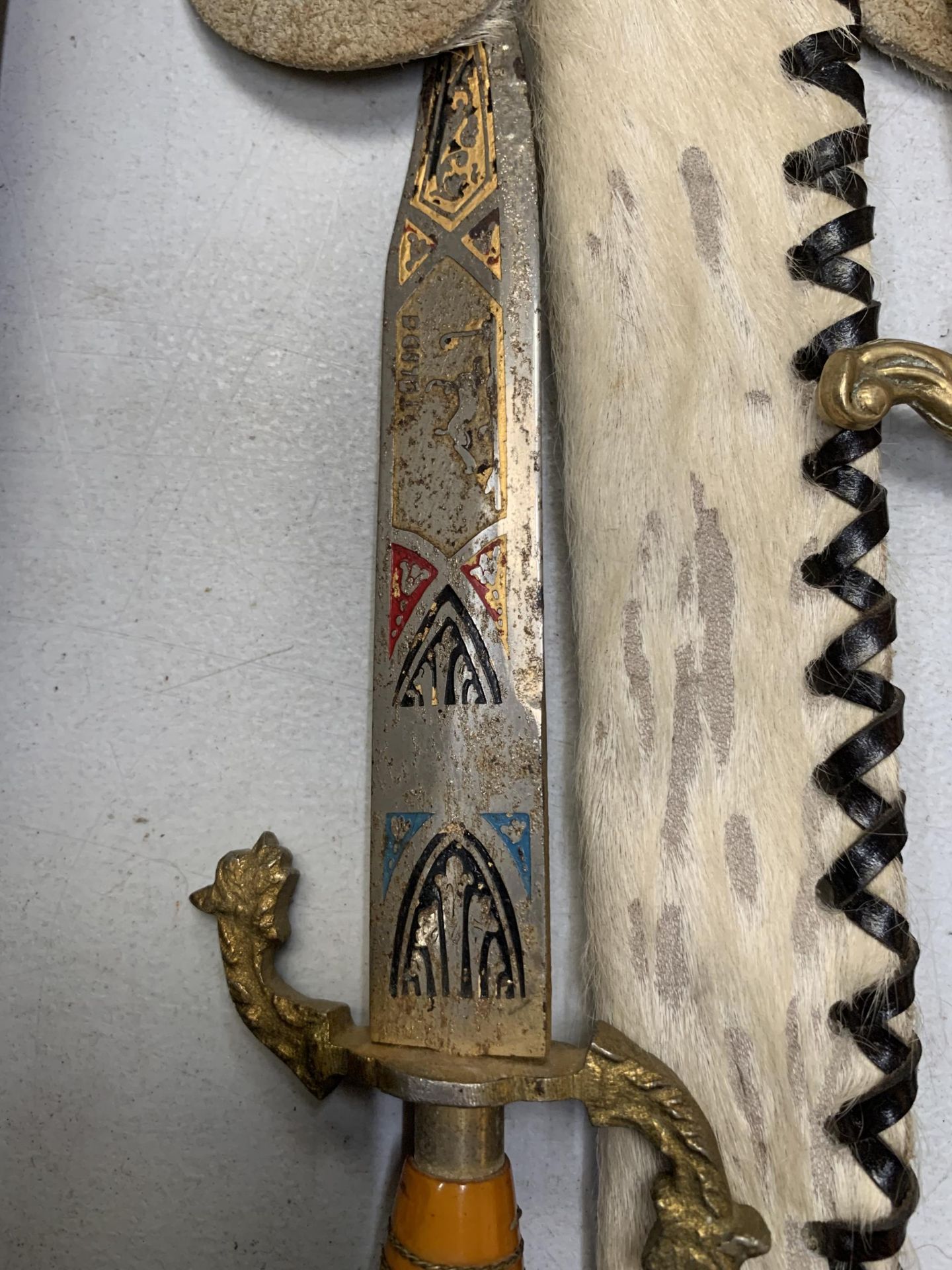 AN ORNATE KNIFE IN AN ANIMAL SKIN SHEATH AND A BRASS LETTER OPENER - Image 3 of 4