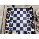 A NAUTICAL BOXED CHESS SET WITH RESIN FIGURES