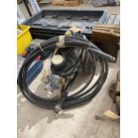 AN ELECTRIC PRESSURE WASHER AND HOSE