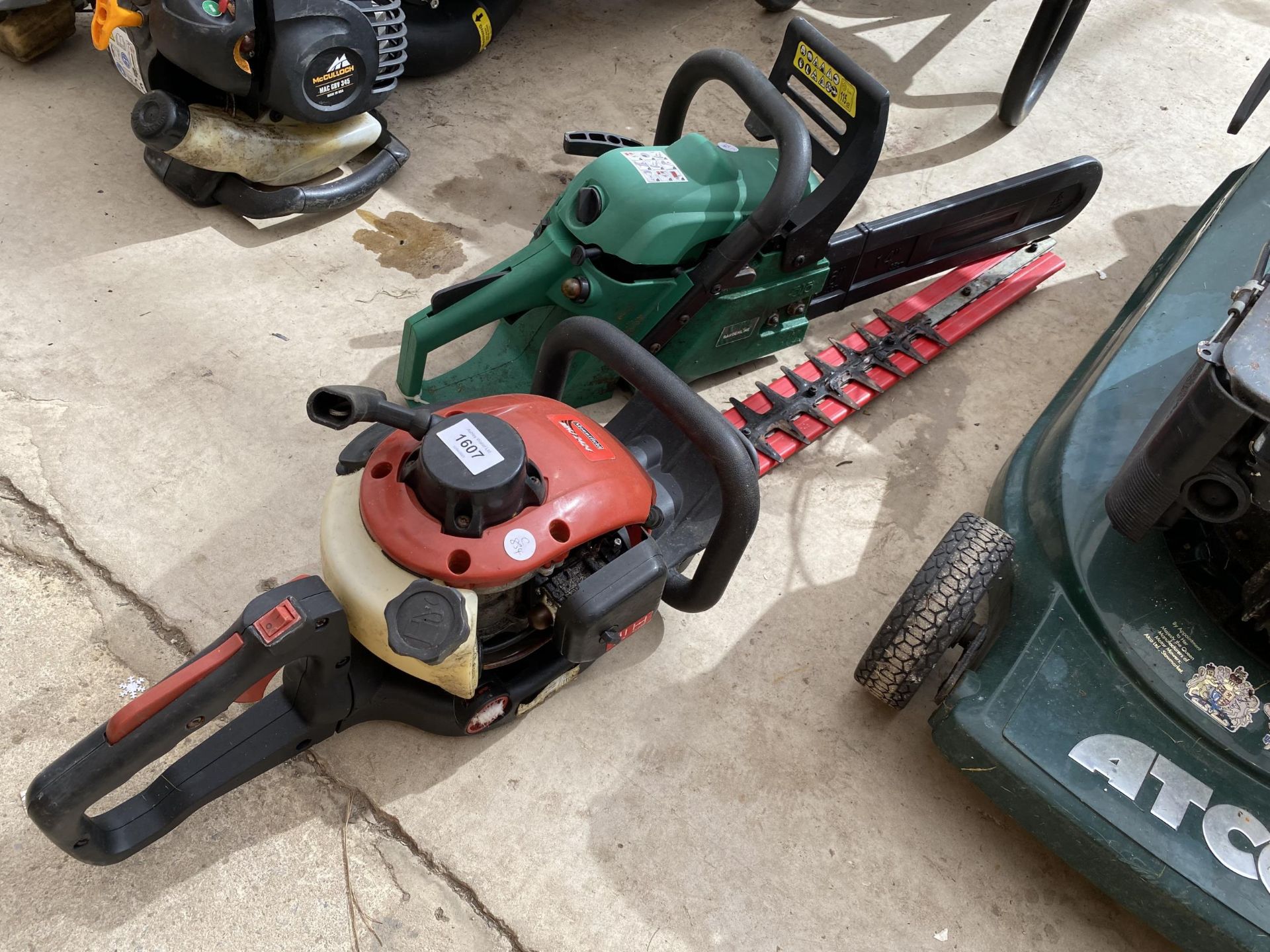 A MOUNTFIELD PETROL HEDGE TRIMMER AND A PETROL CHAINSAW