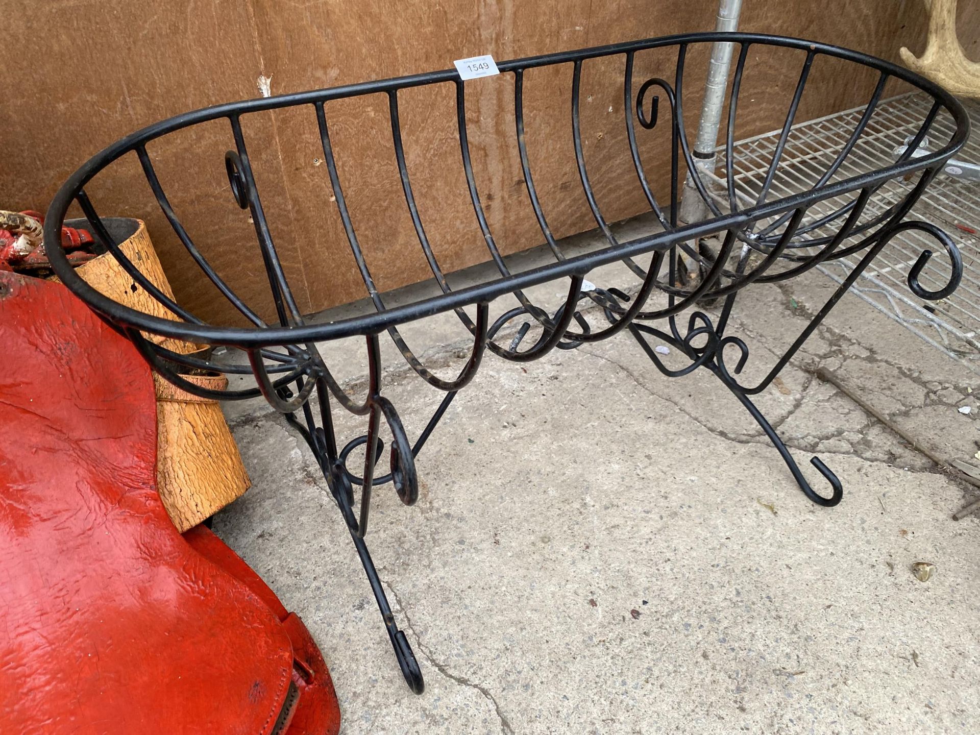 A WROUGHT IRON HAYRACK TROUGH PLANTER ON LEGS (L:76CM)