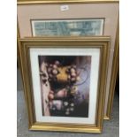 THREE GILT FRAMED PRINTS, TWO STILL LIFE FLOWERS AND FRUITS, THE OTHER A VICTORIAN STREET SCENE