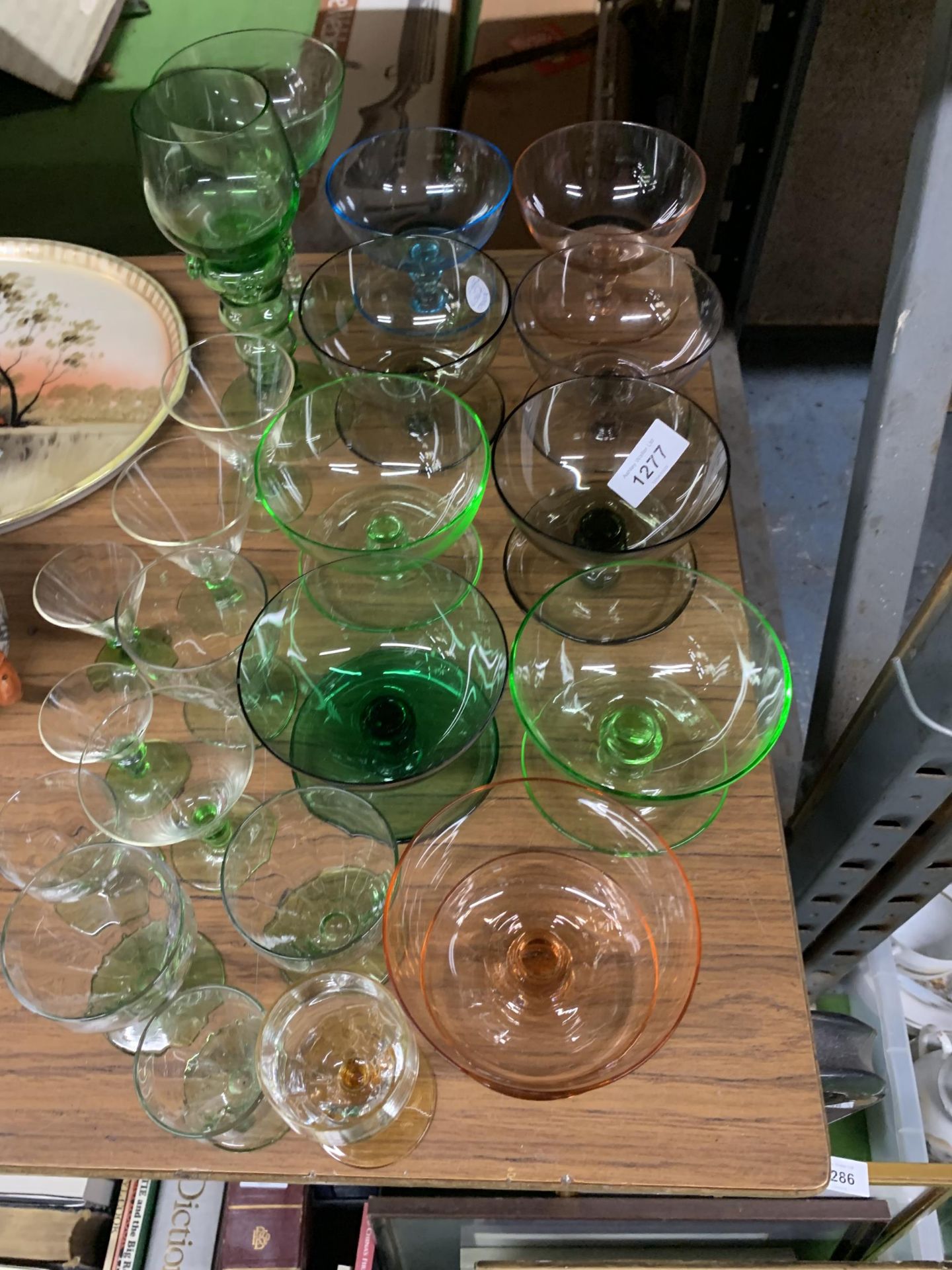 A QUANTITY OF COLOURED GLASS TO INCLUDE DESSERT BOWLS AND DRINKING GLASSES