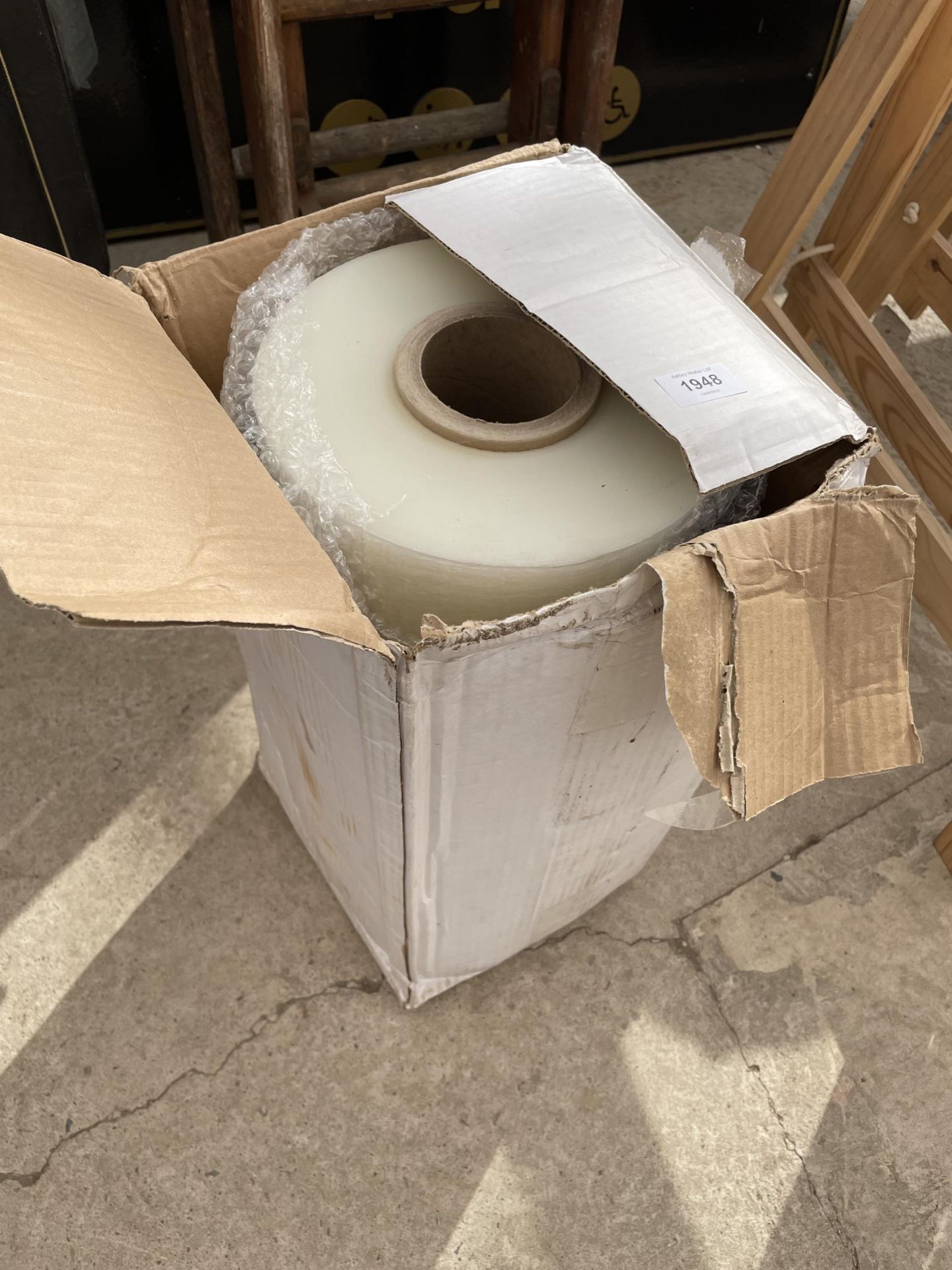 A LARGE ROLL OF SHRINK WRAP