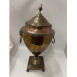 AN EARLY 20TH CENTURY COPPER SAMOVAR WITH LION DESIGN HANDLES