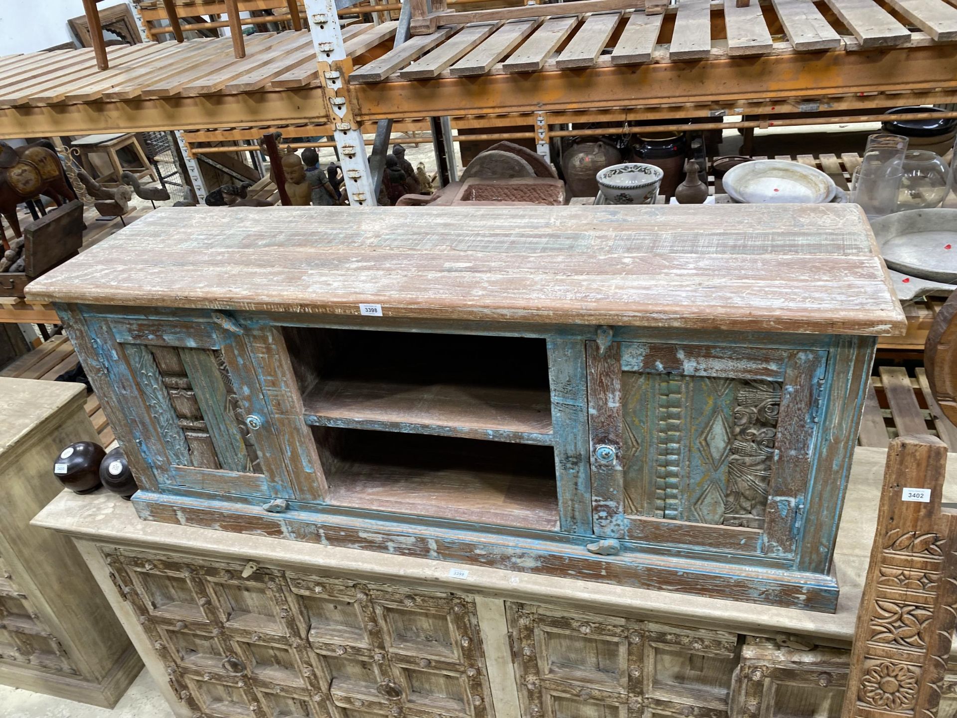 A VINTAGE INDIAN BLUE PAINTED HARDWOOD TV STAND