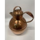 A VINTAGE COPPER KETTLE / WATER JUG WITH INSET GUERNSEY COIN DESIGN