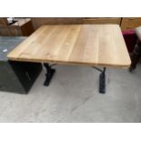 AN OAK PUB TABLE ON CAST BASE, 45 X 36"