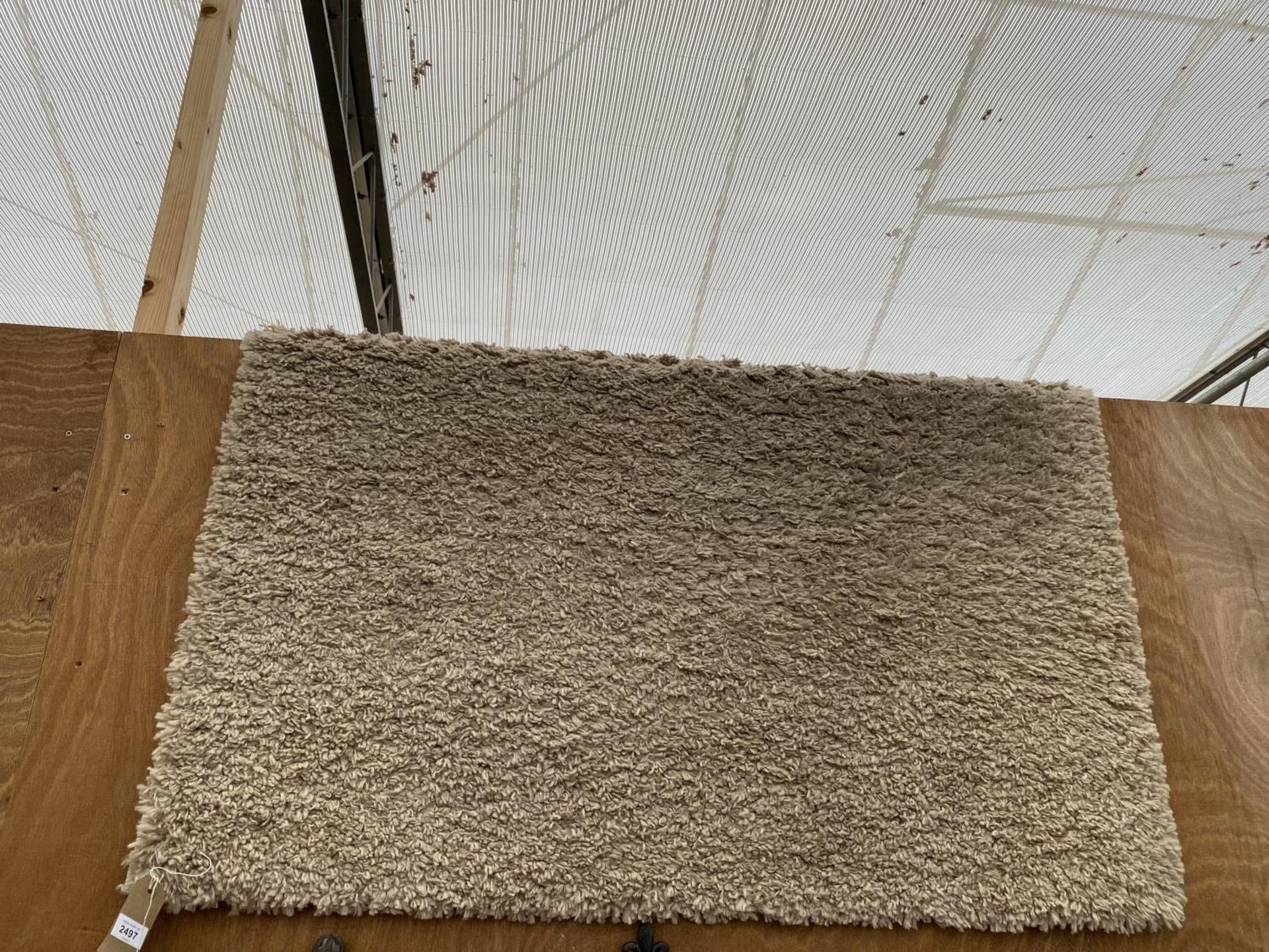 A MODERN CREAM RUG