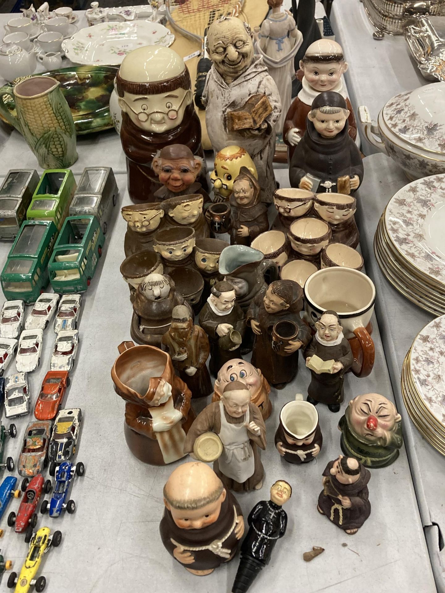 A LARGE COLLECTION OF VINTAGE MONK FIGURES