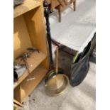 A BRASS BED WARMING PAN AND A FURTHER BRASS PAN