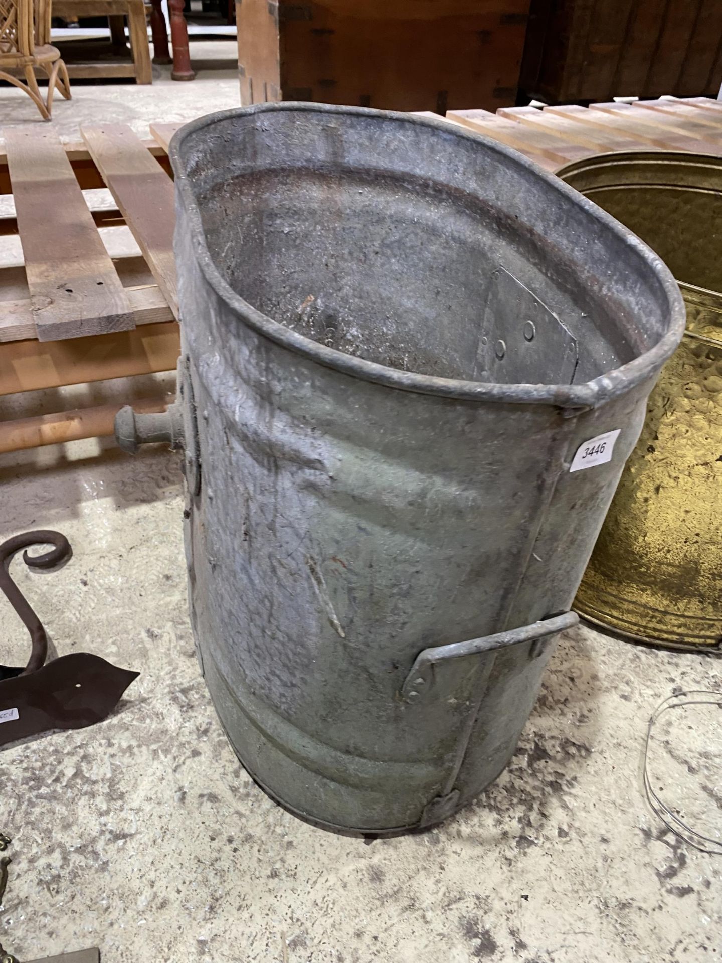 A VINTAGE GALVANISED BUCKET PLANTER