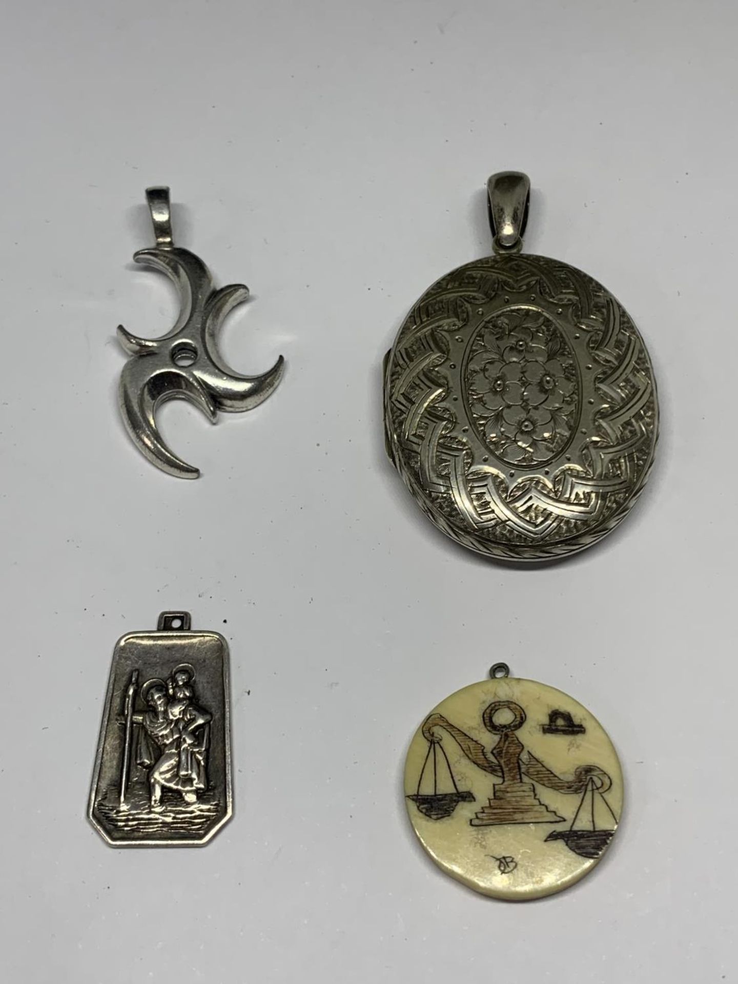 FOUR PENDANTS THREE BEING SILVER