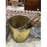 A VINTAGE BRASS BUCKET WITH FIRESIDE ITEMS