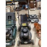 A PETROL LAWN MOWER WITH GRASS BOX AND BRIGGS AND STRATTON ENGINE