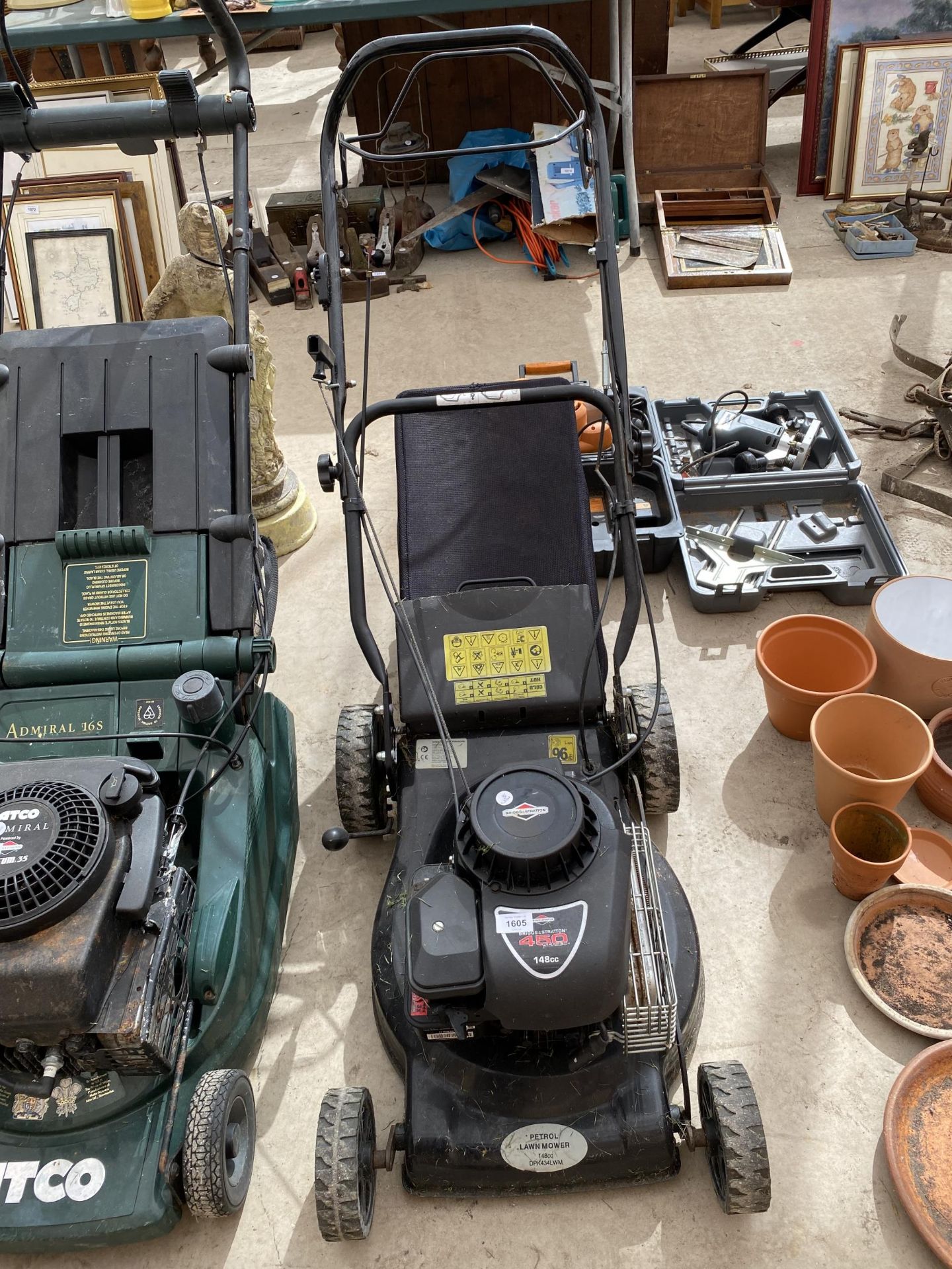 A PETROL LAWN MOWER WITH GRASS BOX AND BRIGGS AND STRATTON ENGINE