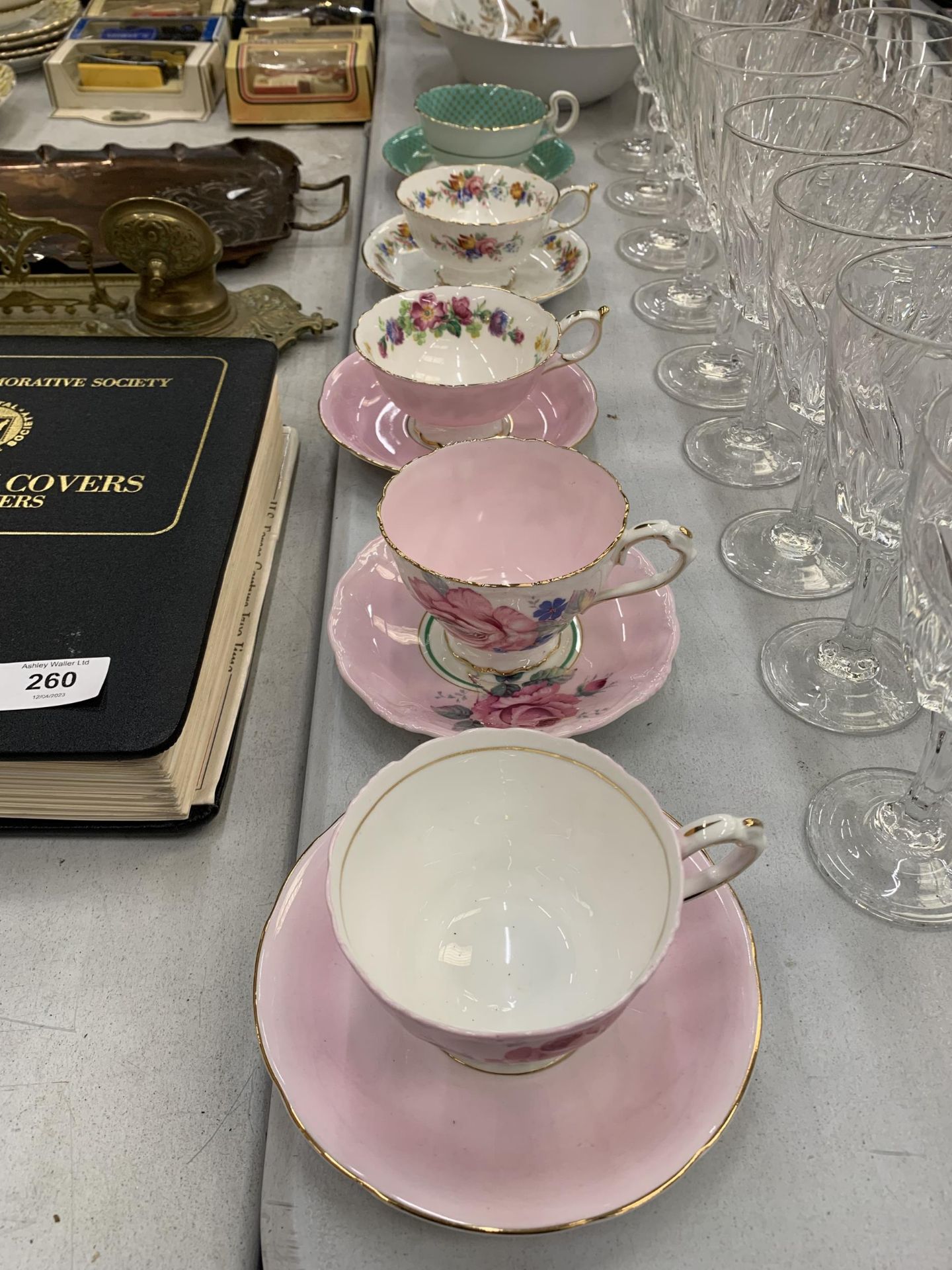 FIVE VINTAGE PARAGON CUPS AND SAUCERS WITH DIFFERENT DESIGNS