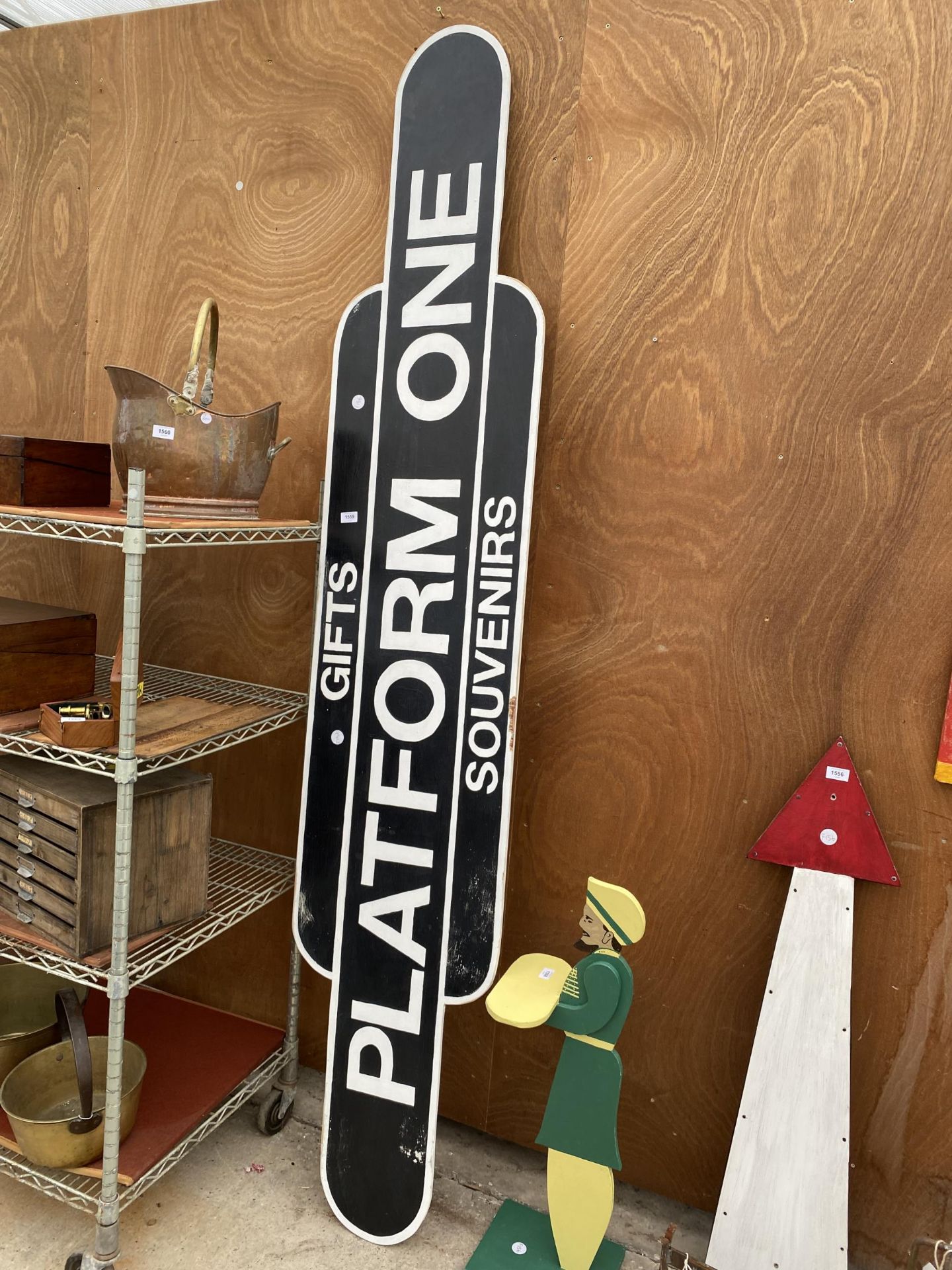 A WOODEN HAND PAINTED 'PLATFORM ONE' SIGN
