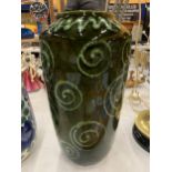 A LARGE DARK GREEN WEST GERMAN VASE WITH SWIRL DECORATION HEIGHT 38CM