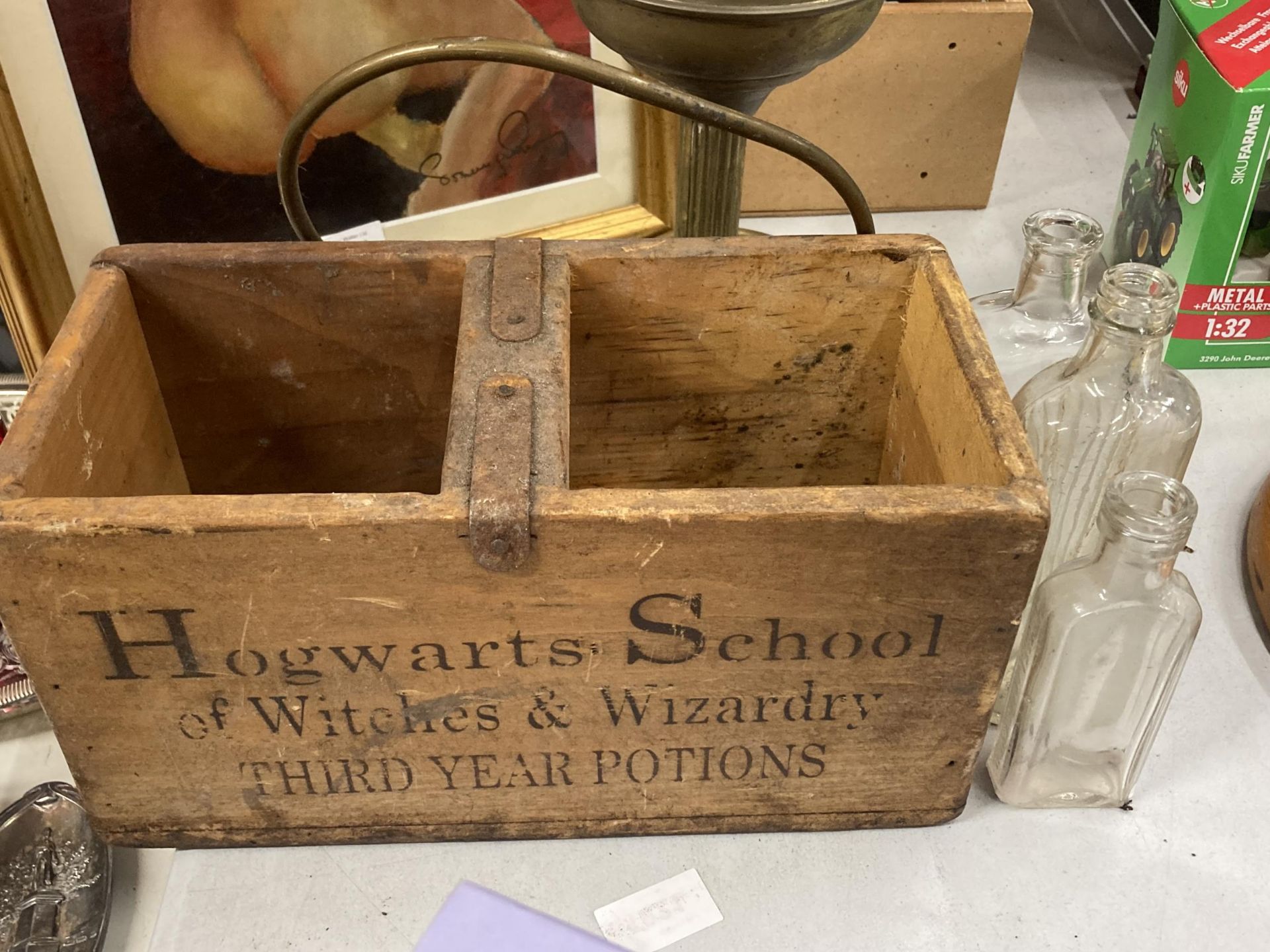 A HOGWARTS SCHOOL OF WITCHES AND WIZARDRY POTIONS AND SPELLS WOODEN BOX WITH THREE GLASS BOTTLES