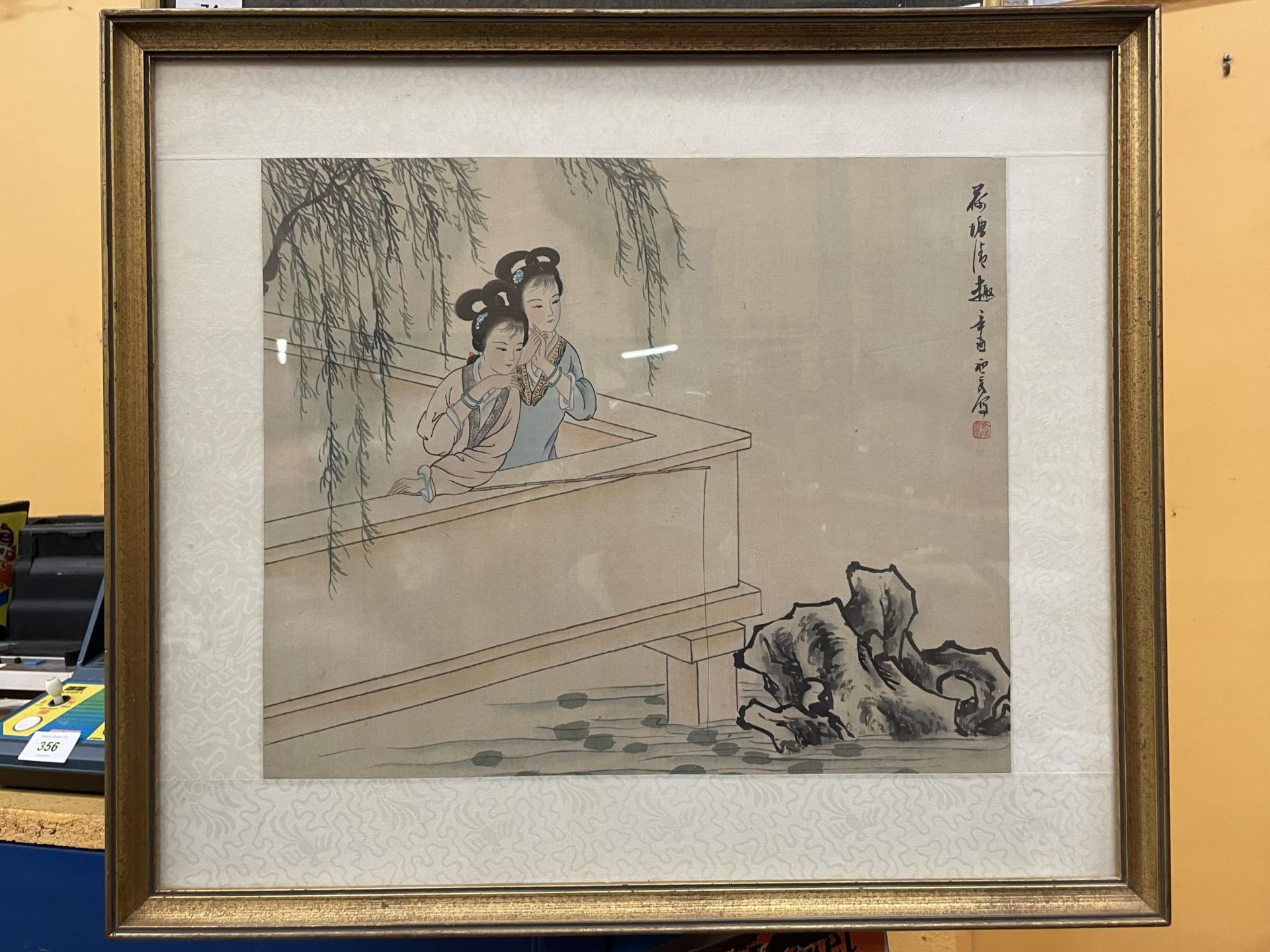 A GILT FRAMED ORIENTAL SIGNED WATERCOLOUR