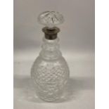 A CUT GLASS MALLET DECANTER WITH LONDON HALLMARKED SILVER COLLAR