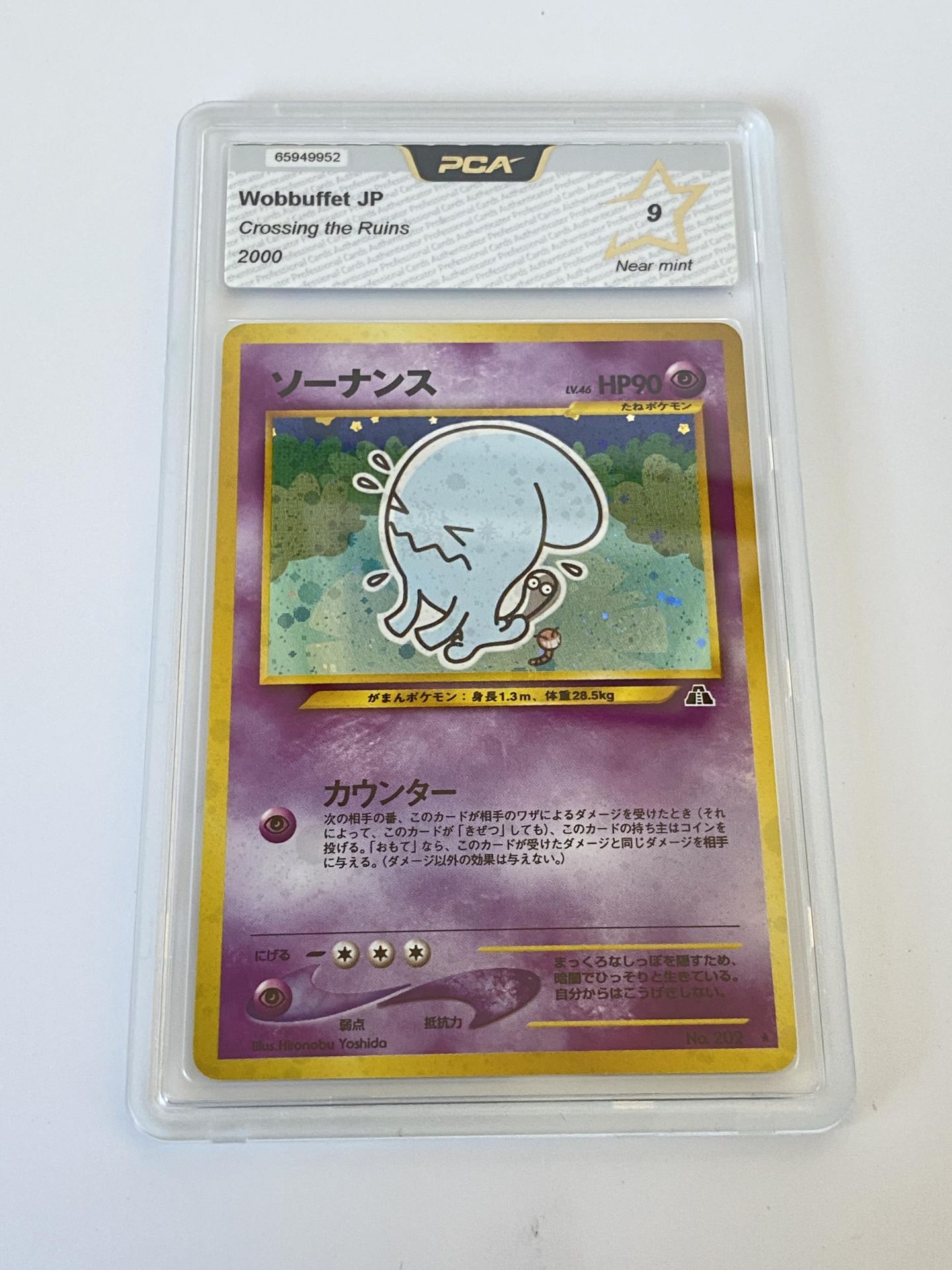 A JAPANESE GRADED POKEMON CARD -WOBBUFFET CROSSING THE RUINS - PCA GRADE - 9