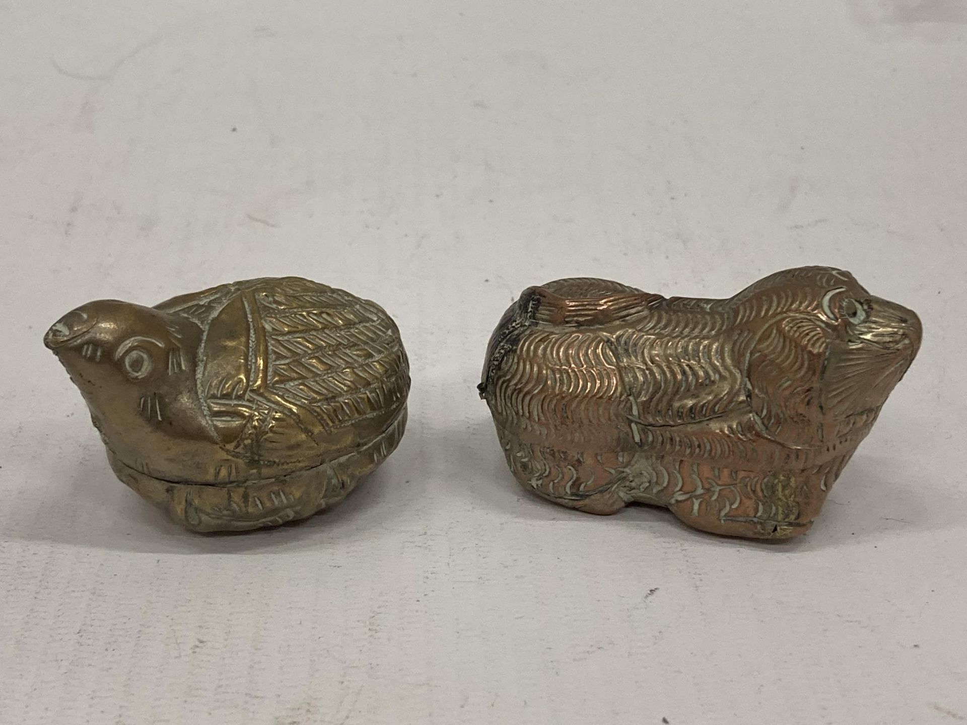 TWO WHITE METAL ORIENTAL LIDDED ANIMAL DESIGN POTS