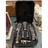 AN SMS ACADEMY BLACK CLARINET IN A FITTED SOFT CASE