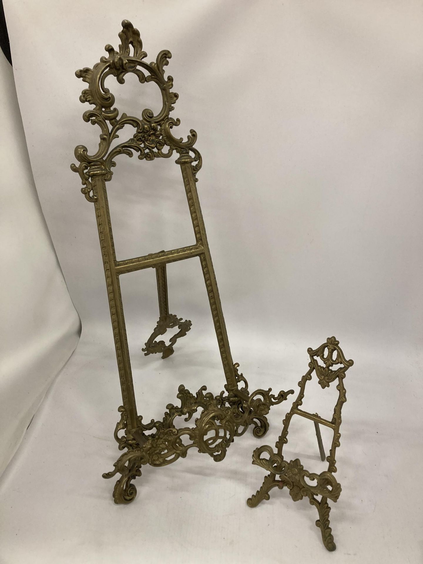 TWO GILT DESIGN DECORATIVE GILT EASELS