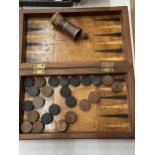 A FOLDING CHESS/BACKGAMMON BOX WITH COUNTERS, DICE AND SHAKER