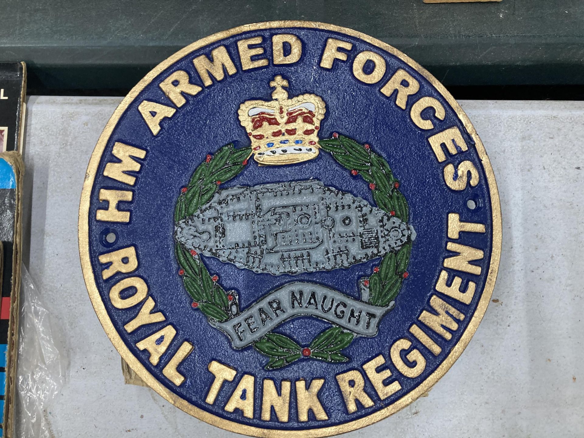 A ROYAL TANK REGIMENT CAST SIGN DIAMETER 23.5CM