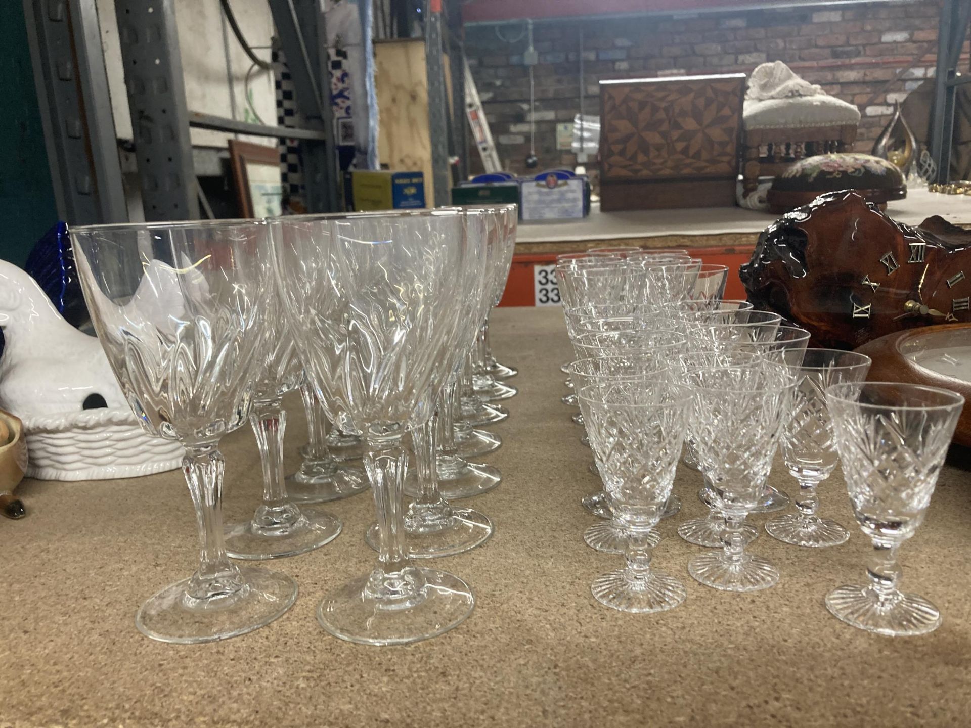 A QUANTITY OF GLASSES TO INCLUDE WINE AND CUT GLASS SHERRY AND PORT GLASSES