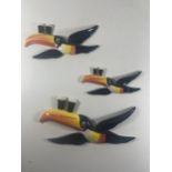 A SET OF THREE CARLTON WARE GUINESS TOUCANS