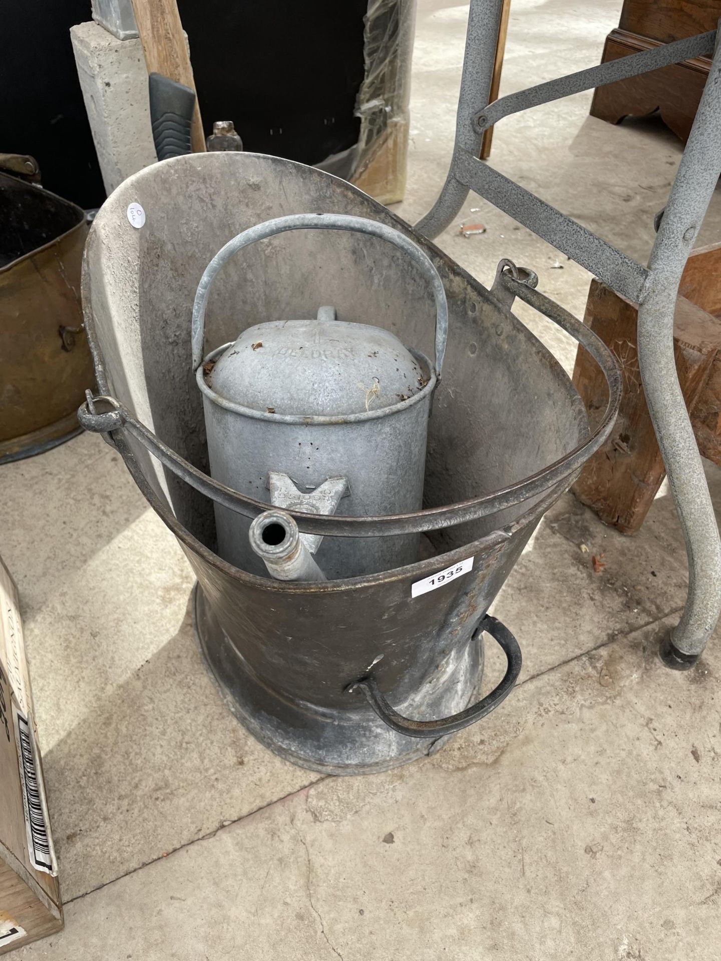 A GALVANISED COAL SKUTTLE AND A GALVANISED WATERING CAN