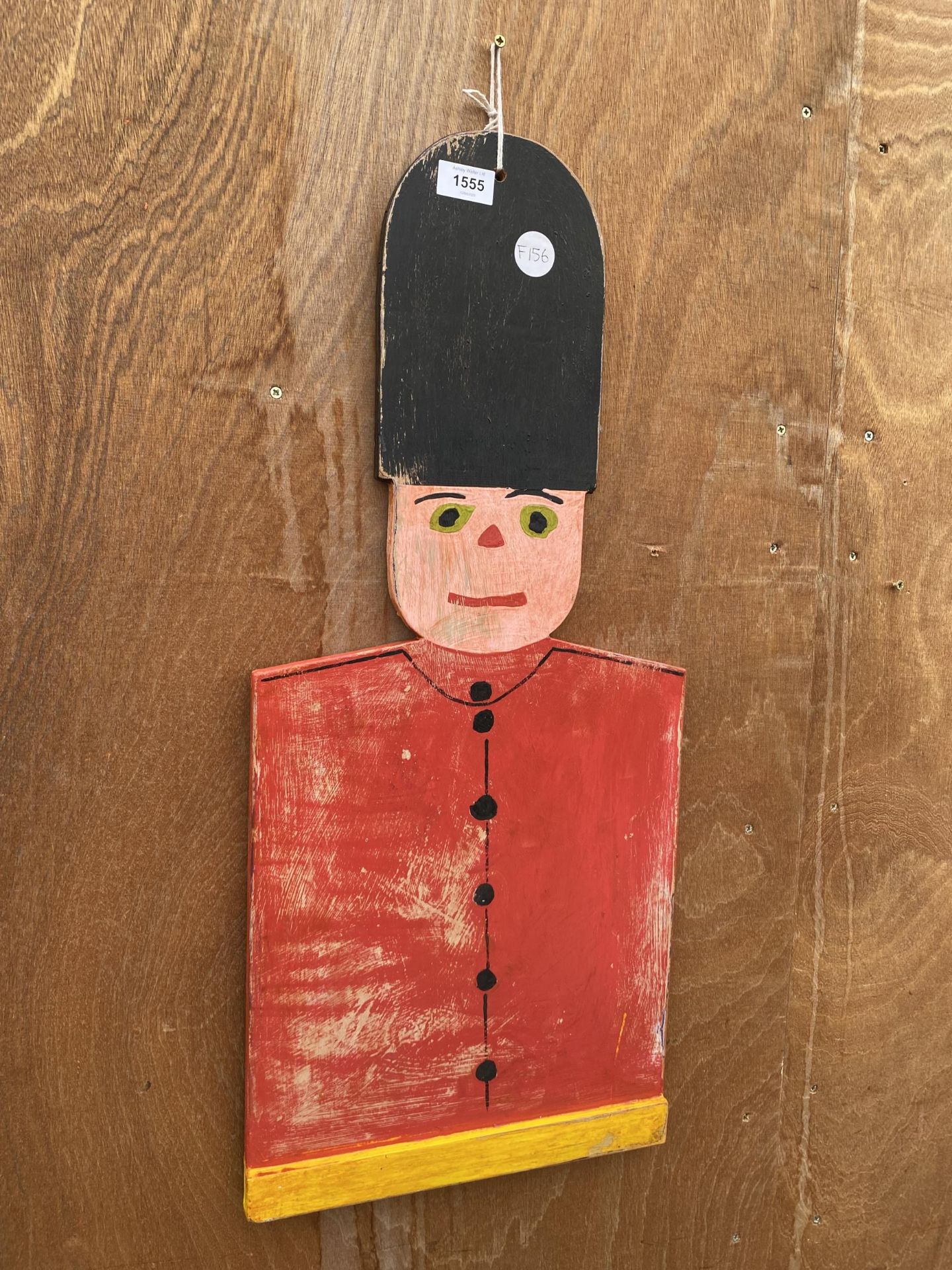 A WOODEN HAND PAINTED SOLDIER PLAQUE