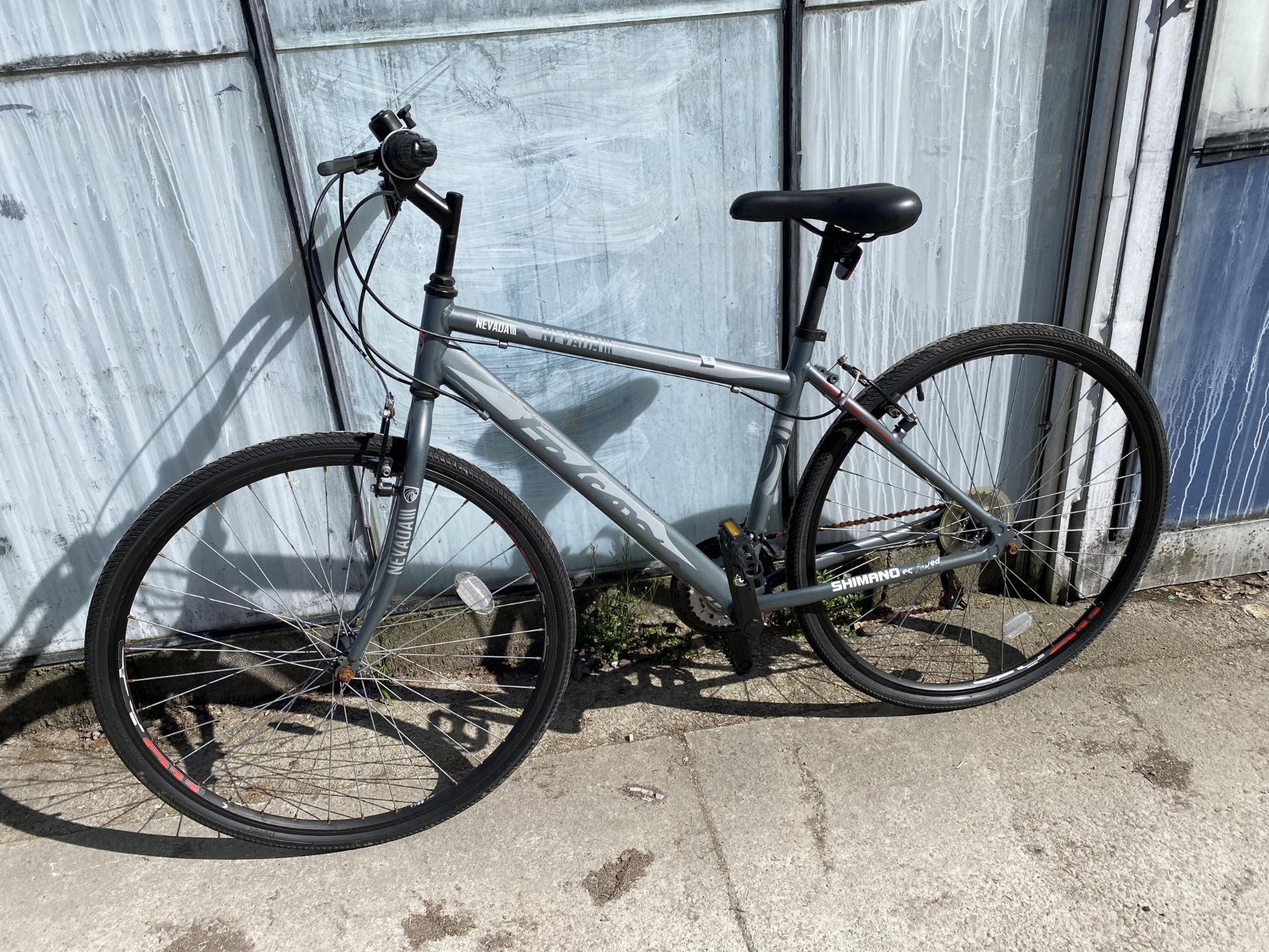 A GENTS FALCON NEVADA III BIKE WITH 18 SPEED SHIMANO GEAR SYSTEM