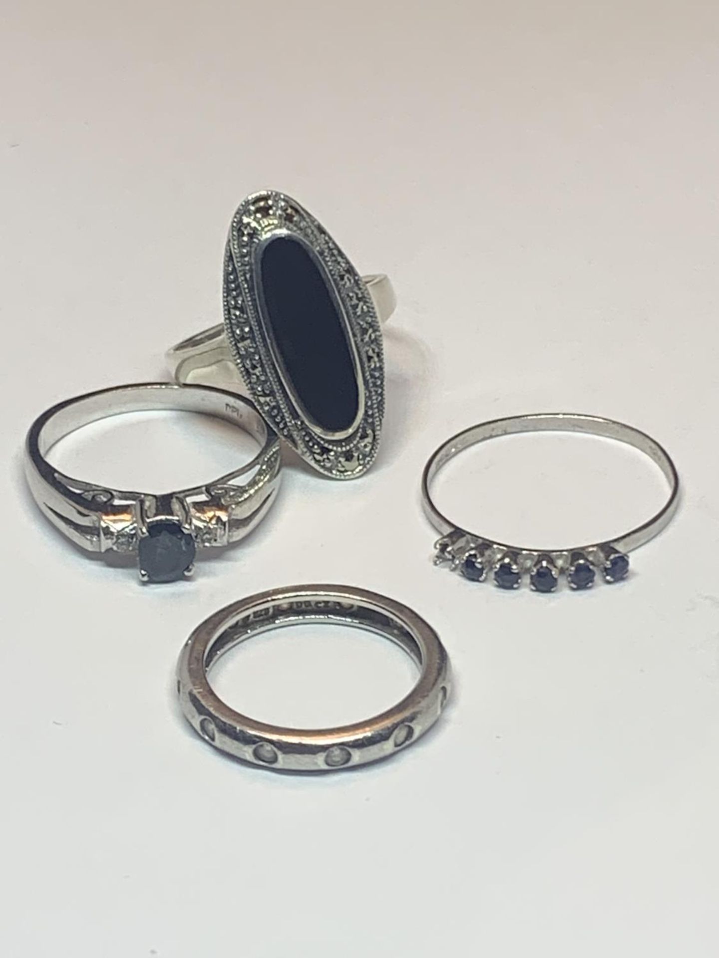 FOUR VARIOUS SILVER RINGS