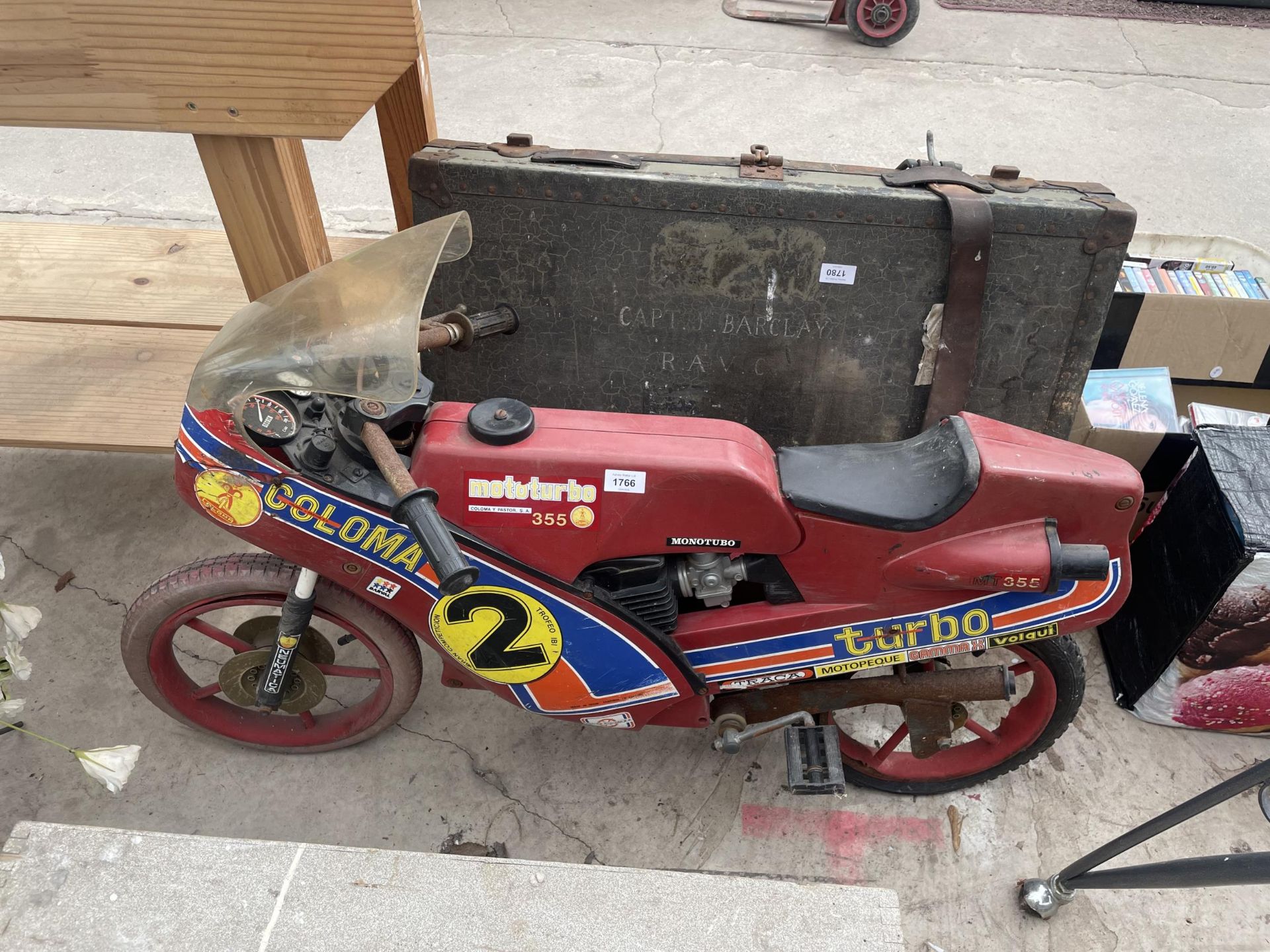 A VINTAGE CHILDS PEDAL BIKE IN THE FORM OF A MOTORBIKE