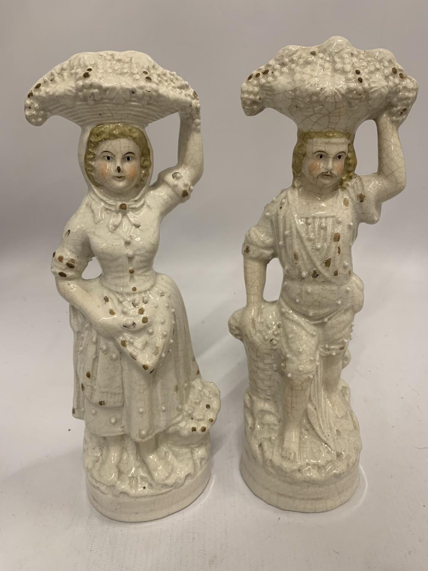 A PAIR OF EARLY STAFFORDSHIRE FIGURES