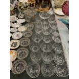 A LARGE QUANTITY OF GLASSWARE TO INCLUDE ETCHED AND FROSTED DESSERT BOWLS, AN ETCHED BOWL ON A STEM,