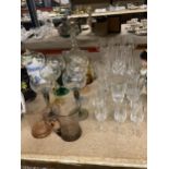 A QUANTITY OF GLASSES TO INCLUDE WINE, A DECANTER, CHAMPAGNE FLUTES, SHERRY, ETC