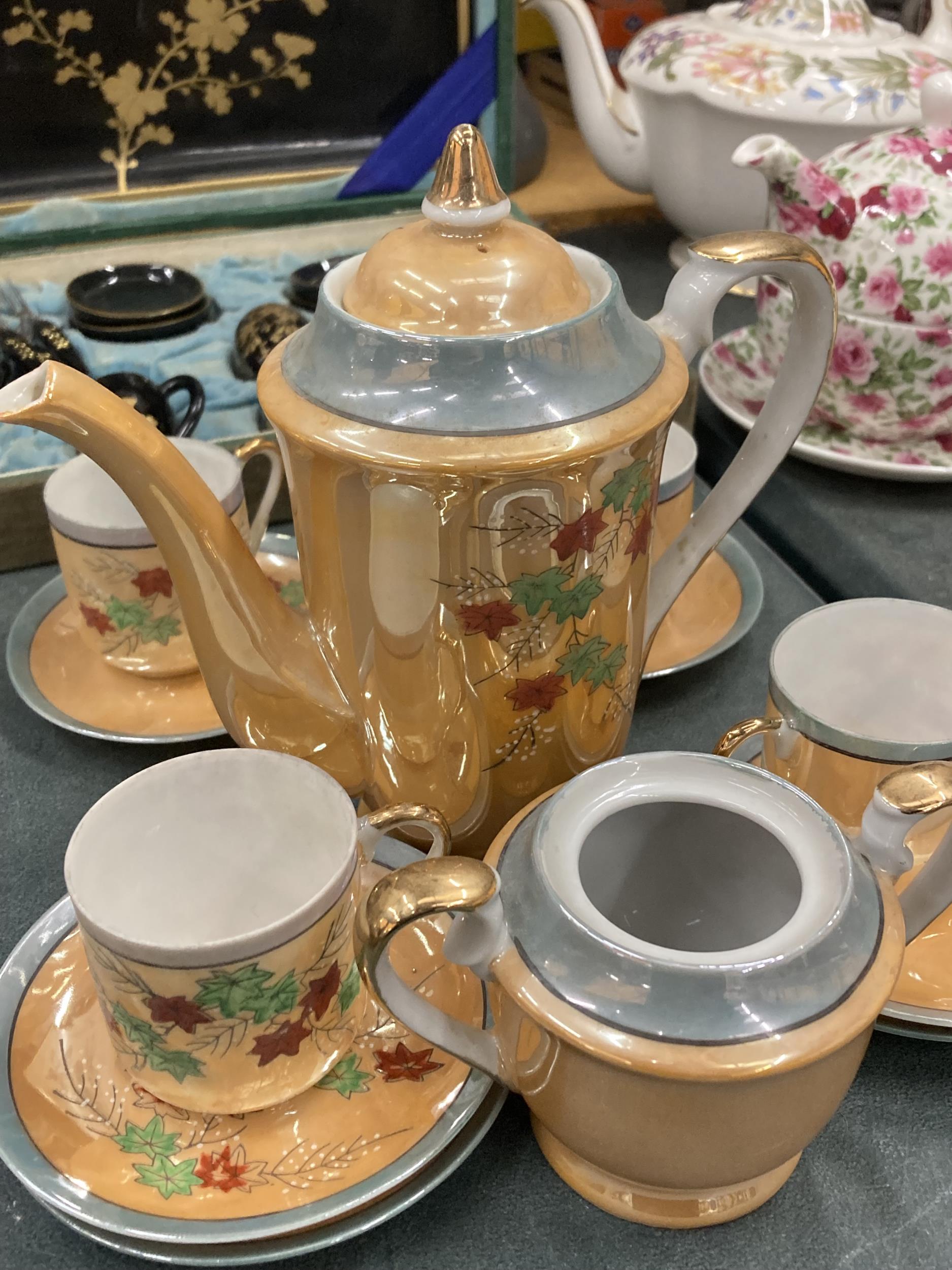 AN ORANGE LUSTRE COFFEE SET TO INCLUDE A COFFEE POT, SUGAR BASIN CUPS AND SAUCERS PLUS A SET OF - Image 2 of 6