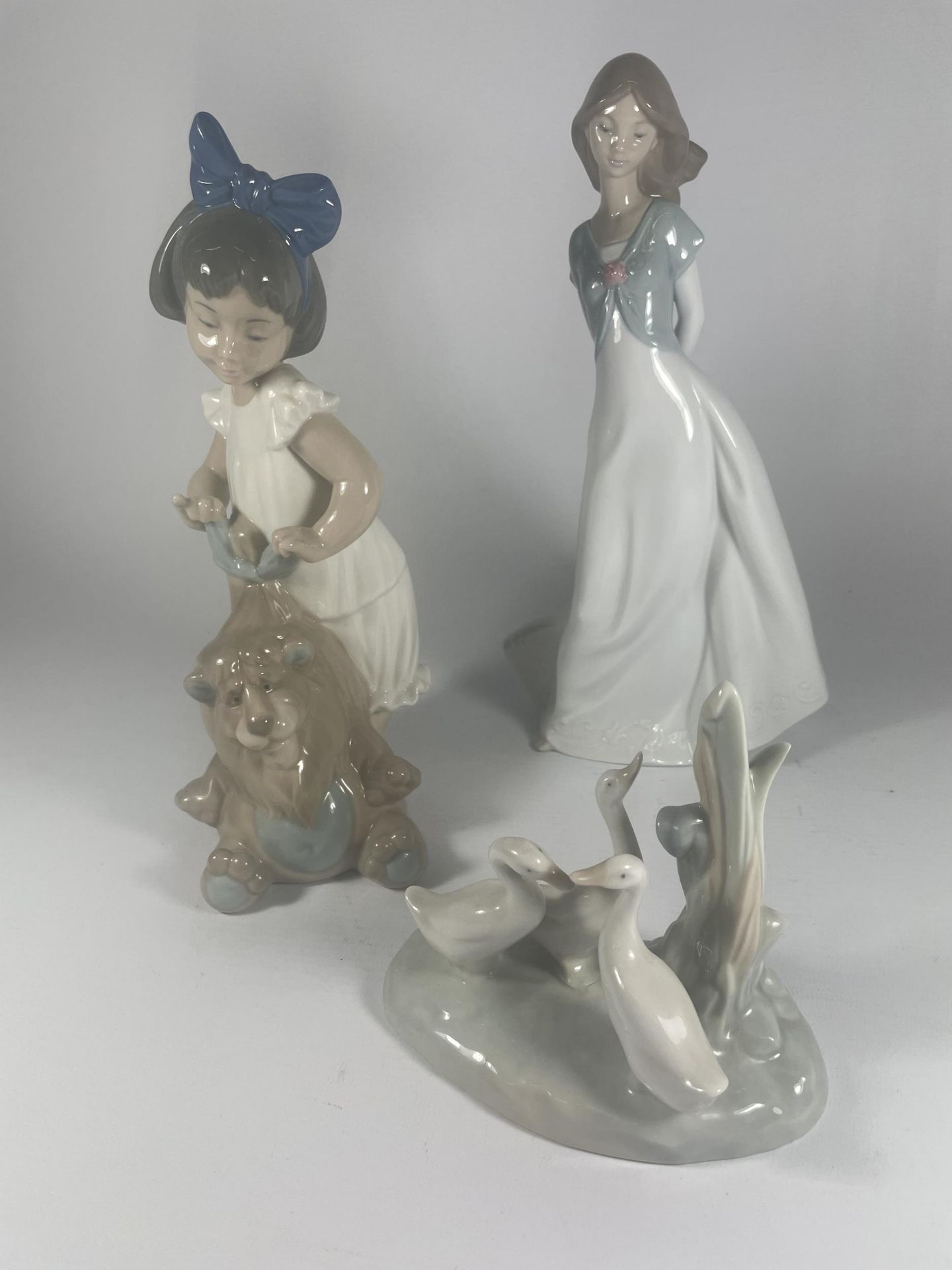 THREE NAO LLADRO FIGURES TO INCLUDE GIRL WITH DOG ETC